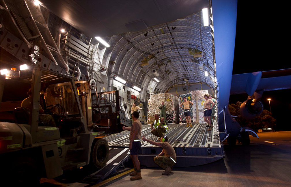 Members of No. 1 Airfield Operational Support Squadron Darwin load a forklift last Tuesday into the cargo hold of a Philippines bound No.36 Squadron C-17A Globemaster that arrived on 13 November 2013. The forklift was used to unload supplies upon arrival in the Philippines. (Photo: CPL Glen McCarthy ©Commonwealth of Australia, Department of Defence)